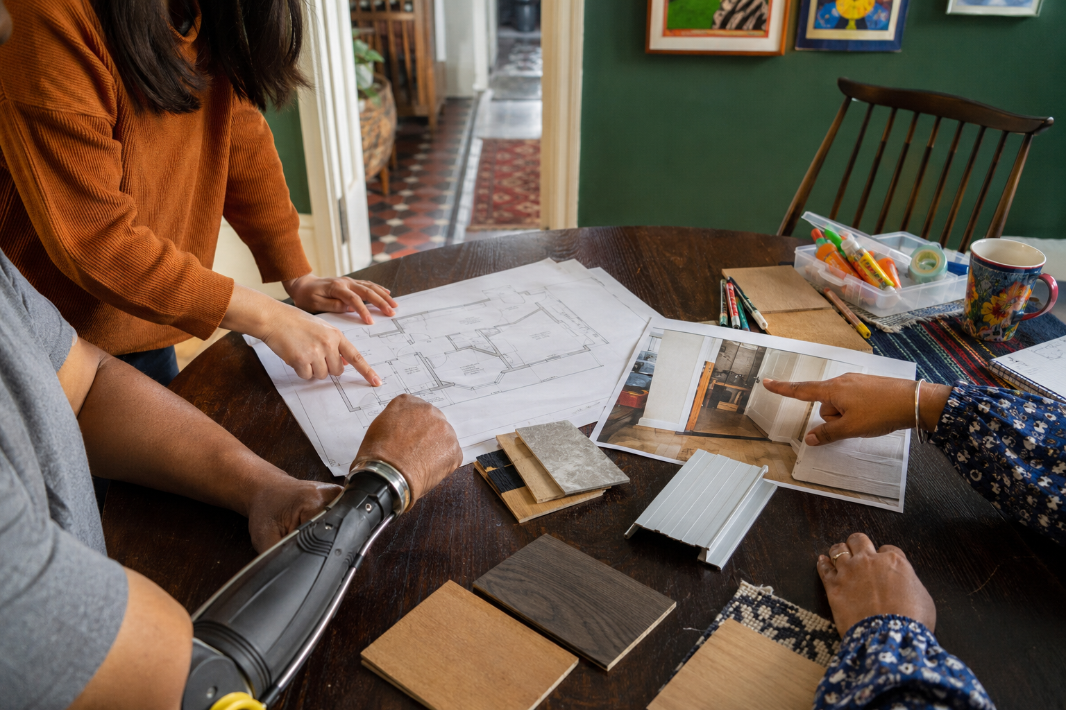 Home adaptation ideas and material samples being reviewed together around a table